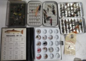 A collection of fishing items, to include flies