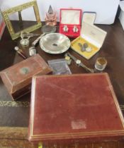 Three Art Nouveau silver buttons, a cased pair of silver condiment pots, a Victorian scent bottle