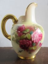 A Royal Worcester flat back jug, decorated with roses Fildes, height 5.25ins