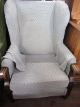 A 19th century style wing back armchair