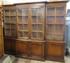 A 19th century oak breakfront bookcase, with glazed doors to the upper section and cupboard doors to