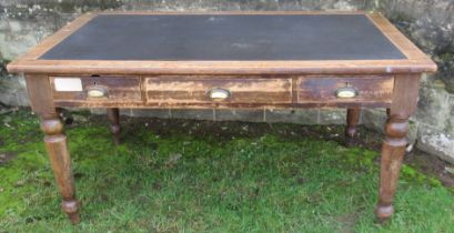An oak desk, with inset writing surface and fitted with frieze drawers, 36ins x 60ins, height 30.