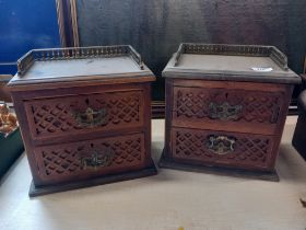 A pair of galleried table top cabinets
