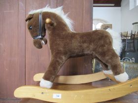 A modern rocking horse, height 21ins width 29ins