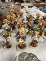 A large collection of Hummel/Goebel figures