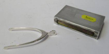 A hallmarked silver wishbone sugar nips and a silver match box holder