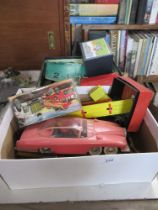 A box of toys including Lady Penelope and a vintage horse game