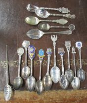 A collection of silver souvenir spoons, weight 4oz, together with a silver mote spoons and other