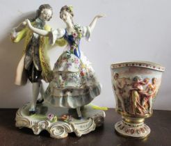 A 20th century Continental porcelain beaker, with embossed decoration of figures, height 4.5ins,