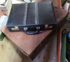 A vintage suitcase and a briefcase