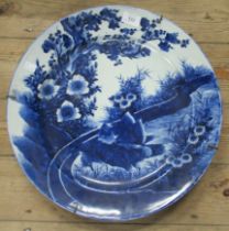 An Oriental blue and white wall plate, diameter 17ins