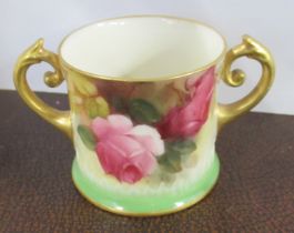 A Royal Worcester two handled mug, decorated with roses, height 2ins