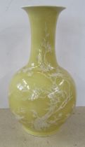 A modern yellow ground vase, with white flowering decoration, height 12ins