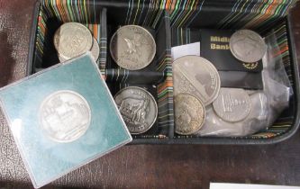 A collection of coins and token, in a gents Porsche leather covered case