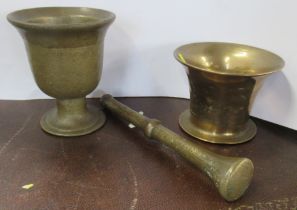 Two brass mortars and a pestle