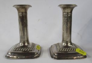 A pair of silver candlesticks, height 5ins