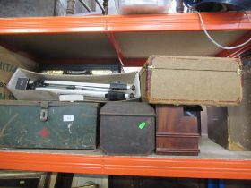 A collection of trunks, tins etc