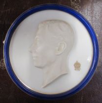 A Royal Worcester circular relief plaque, of King George VI, diameter 6.25ins