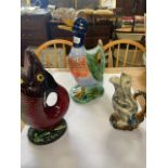 A collection of novelty duck, fish and frog jugs, some af