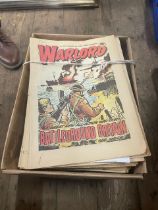 A box of warlord comics