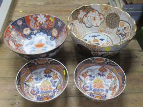 A pair of Imari pattern bowls, diameter 10ins, together with two other larger Imari pattern bowls