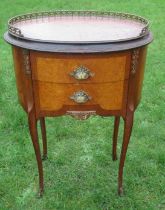 A French style oval bedside cabinet, with gallery top, fitted with two drawers, 20ins x 13.5ins,