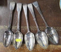 A pair of silver fiddle pattern serving spoons, together with three other spoons, all engraved