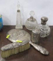 A collection of silver mounted glass dressing table bottles, together with a silver cherub