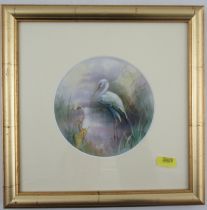 A circular porcelain plaque, believed to be Royal Worcester, decorated with a Heron in water with