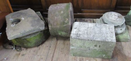 A collection of garden blocks, two wheels  etc