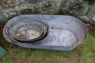 A galvanized tin bath, width 47.5ins, together with three other tin