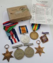 Two World War One medals, a World War Two Defense Medal, two Star Medals etc with ribbons