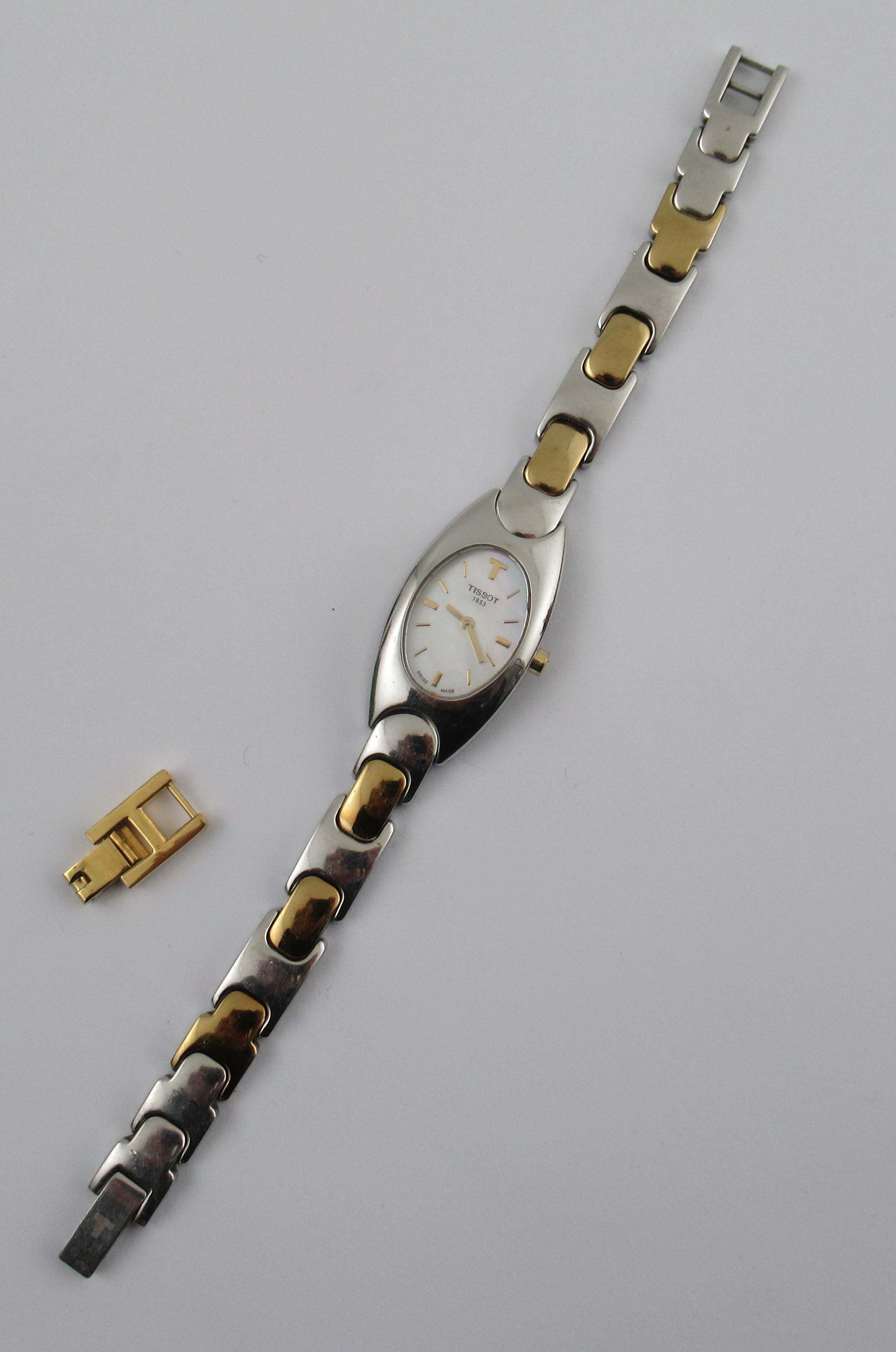 A Tissot stainless steel dress watch, with bimetal link strap, in case