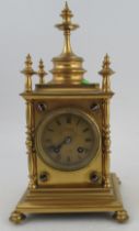A Victorian gilt metal cased mantel clock, with striking movement, the gilt dial inscribed J W