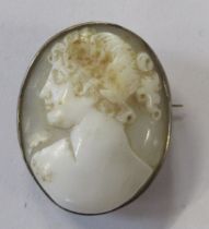 An oval cameo brooch, carved with a Classical portrait