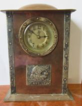 An Arts and Crafts style copper cased mantel clock, with silver coloured mounts, height 7ins