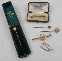 A 15ct gold hunting crop stock pin, together with two brooches and three Victorian stick pins