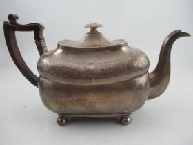 A Georgian silver Irish tea pot, with bright cut decoration , raised on ball feet, weight 21oz