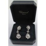 A good pair of 18ct white gold diamond double cluster articulated drop earrings, each set with 47