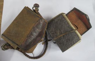 An Antique leather bound Qu'ran, in leather carry case