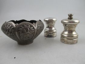 An Eastern design white metal bowl, together with a pair of hallmarked silver salt and pepper