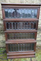 A Globe Wernicke leaded light four section bookcase, width 34ins, depth 14ins, height 60ins