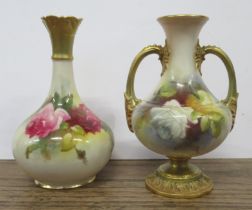 A Royal Worcester vase, decorated with roses, with gilt hoop handles, shape No 2021, height 5.75ins,