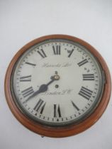 A late 19th / 20th century walnut case wall clock, Harrods limited dial with Roman numerals,