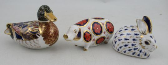 Three Royal Crown Derby paperweights, a pig, rabbit and a duck