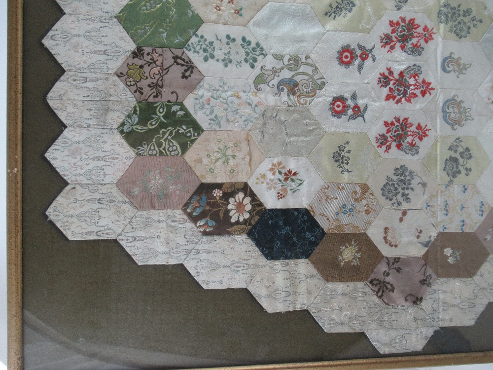 An 18th century patchwork quilt, with a hexagonal design, mounted in a glazed frame - Image 3 of 5