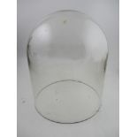 A glass dome, height 16ins, width 12ins