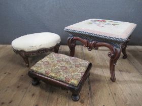 A Victorian mahogany carved stool with needlework cover and two other small footstools, one oval and