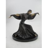 An Art Deco bronze and gilt model, of a lady in period dress, stamped Lorenzl, height 9.5ins