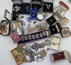 A collection of costume jewellery, to include silver and other brooches, necklaces, a silver cased